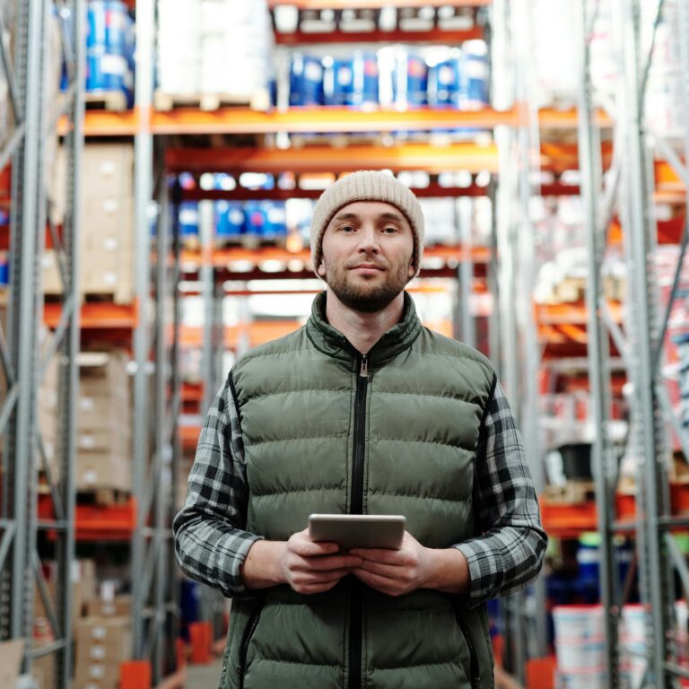 A manufacturing employee with a tablet